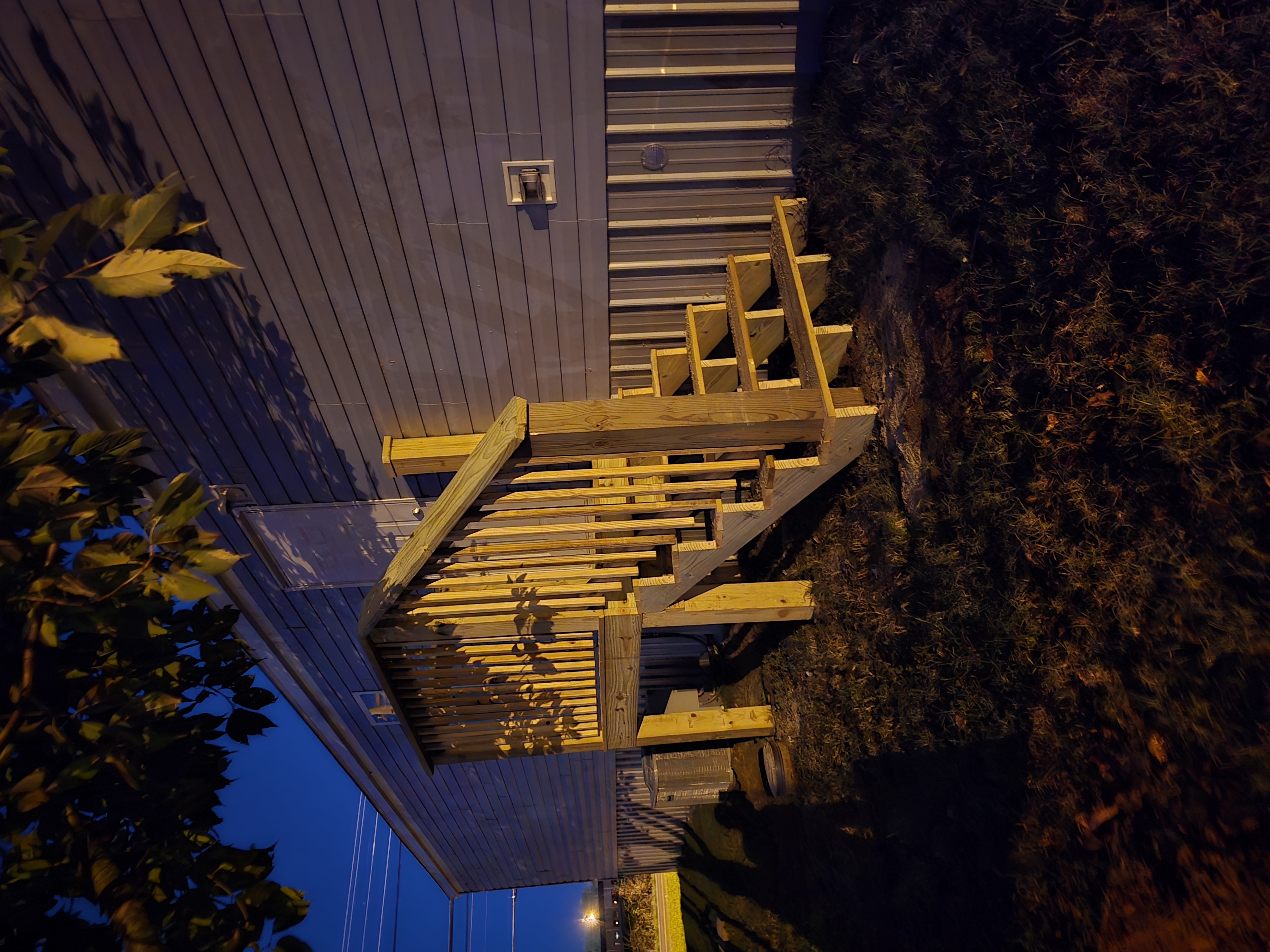 Deck framing inspection in Lawrence County Tennessee showing correct joist hanger installation